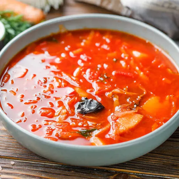 Traditional Ukrainian soup with beets, tomatoes, and pork ribs